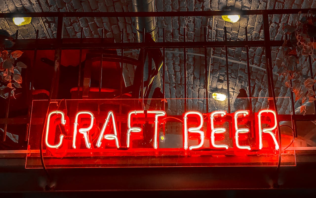 Vibrant red neon sign for craft beer at a bar in Budapest, Hungary.